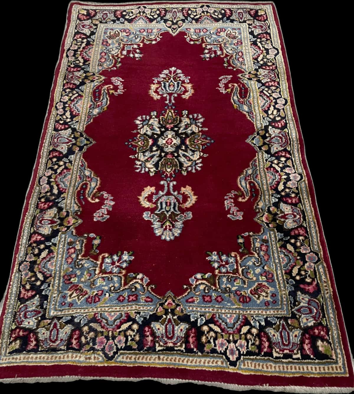 Persian rug of Kerman style in dimensions 145 centimeters length by 88 centimeters width with mainly red and blue colors — Perspective