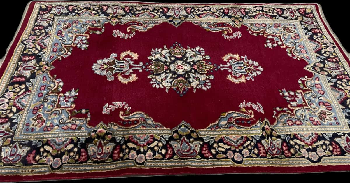 Persian rug of Kerman style in dimensions 145 centimeters length by 88 centimeters width with mainly red and blue colors — Perspective