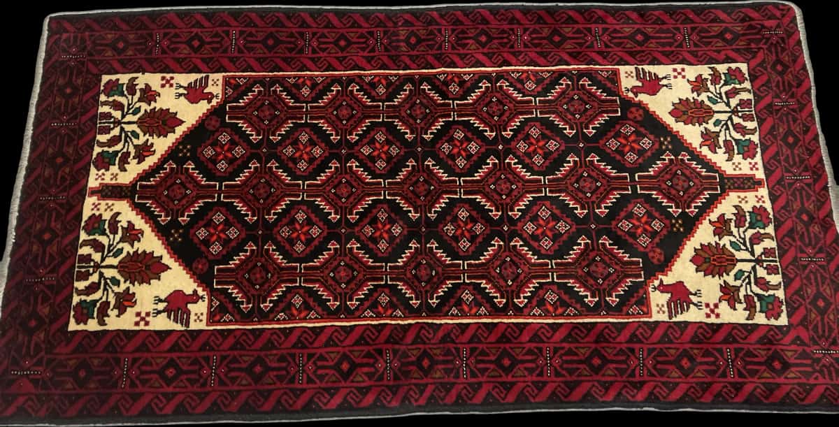 Persian rug of Baluch style in dimensions 194 centimeters length by 105 centimeters width with mainly red colors — Perspective