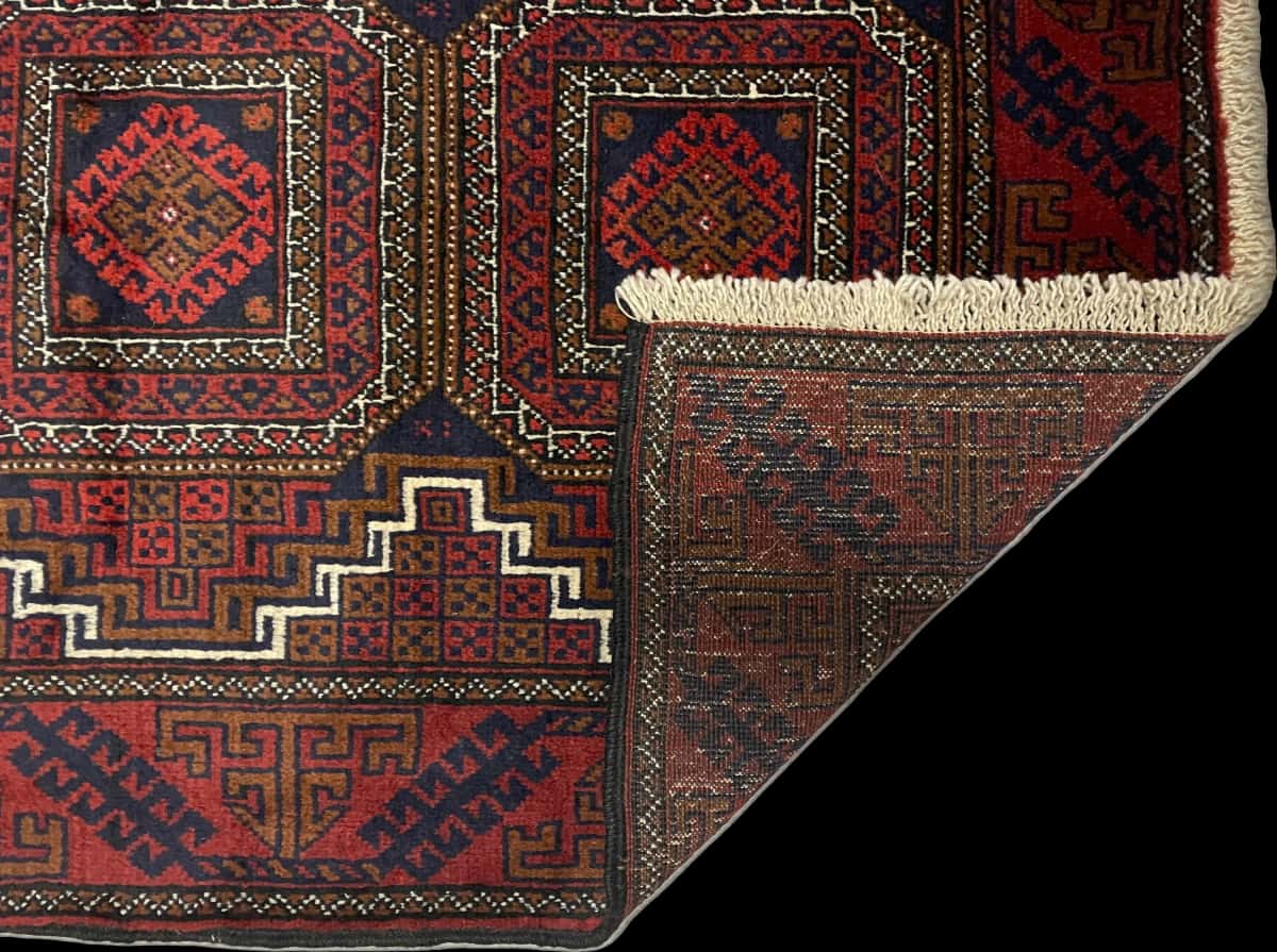 Persian rug of Turkoman style in dimensions 162 centimeters length by 87 centimeters width with mainly red colors — Folded