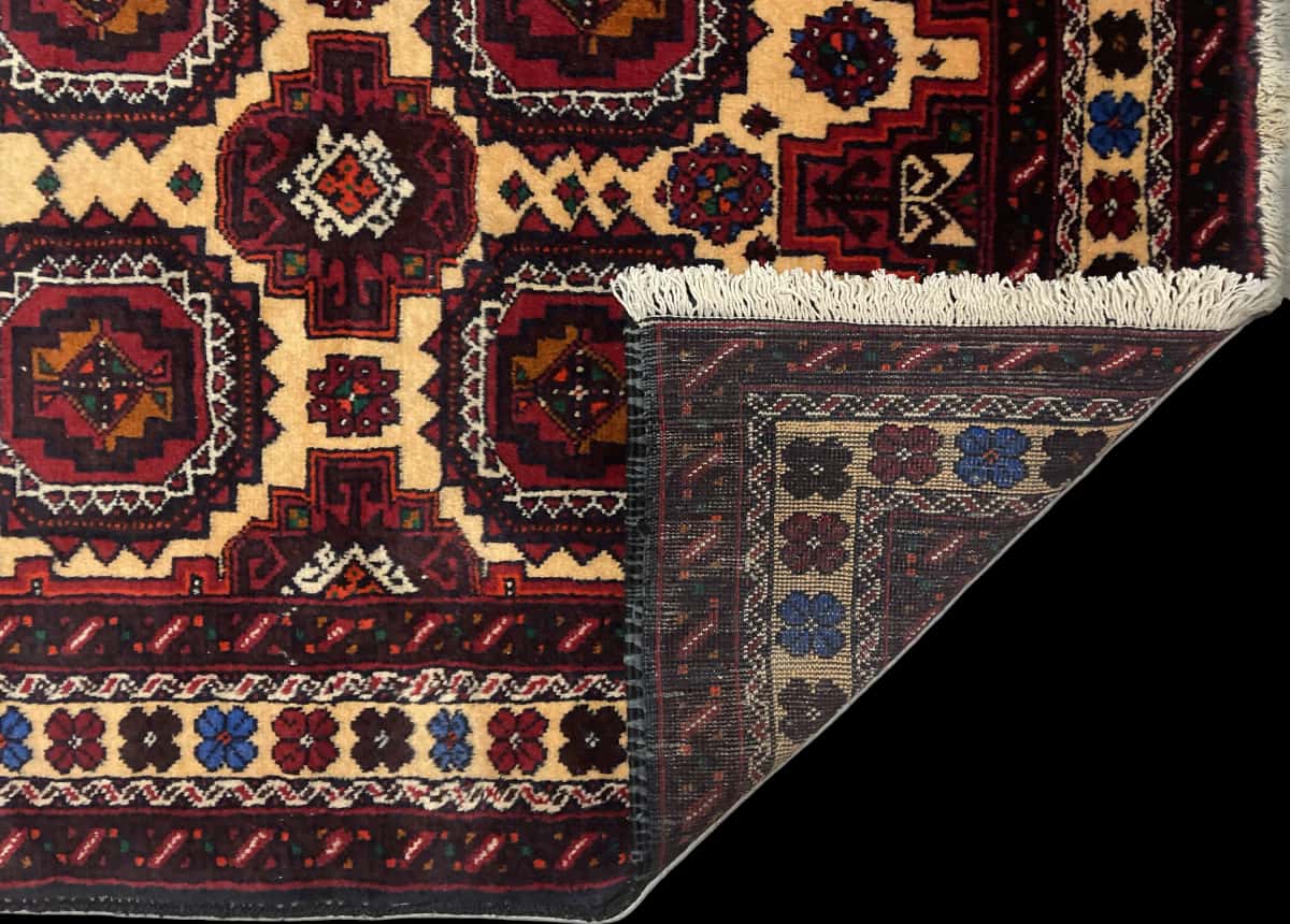 Persian rug of Baluch style in dimensions 193 centimeters length by 100 centimeters width with mainly red and orange colors — Folded