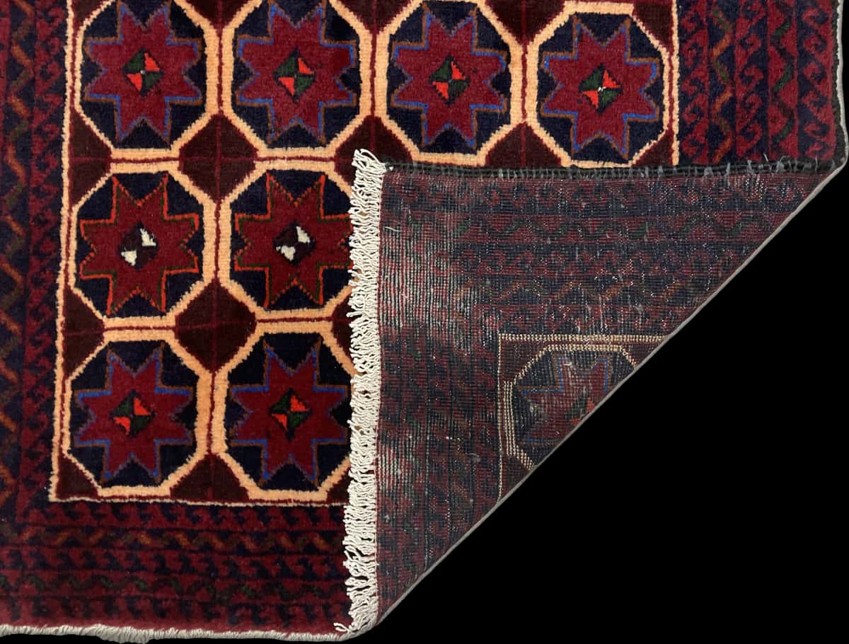 Persian rug of Baluch style in dimensions 190 centimeters length by 95 centimeters width with mainly red and blue colors — Folded