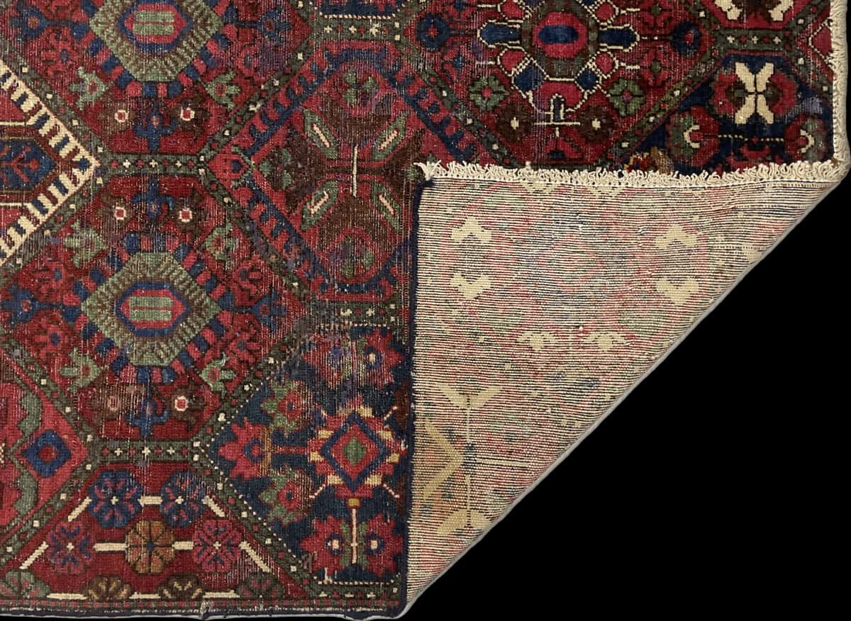 Persian rug of Bakhtiari style in dimensions 220 centimeters length by 105 centimeters width with mainly red and blue colors — Folded