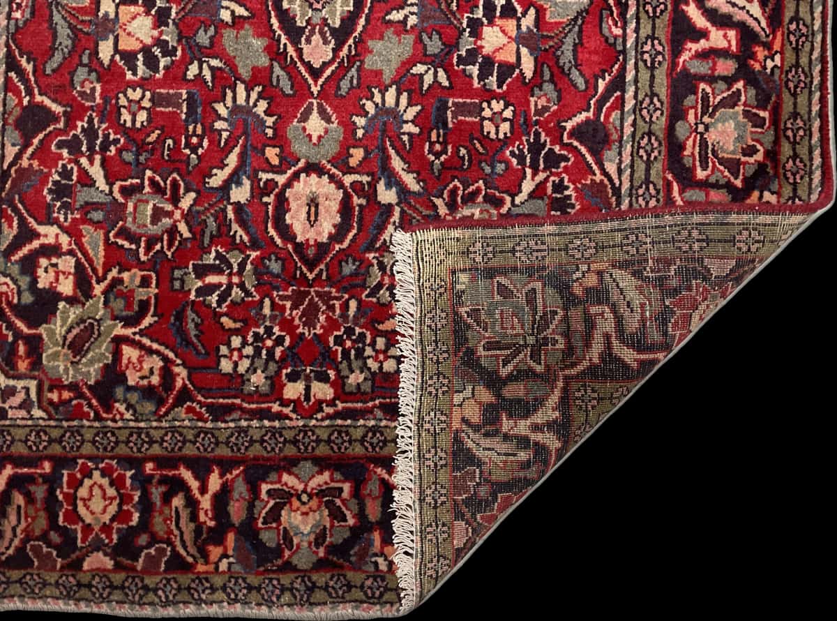 Persian rug of Aran va Bidgol style in dimensions 200 centimeters length by 125 centimeters width with mainly red and green colors — Folded