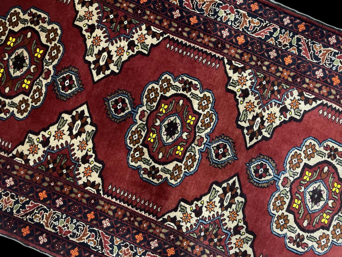 Persian rug of Baluch style in dimensions 198 centimeters length by 111 centimeters width with mainly red and orange colors — Perspective