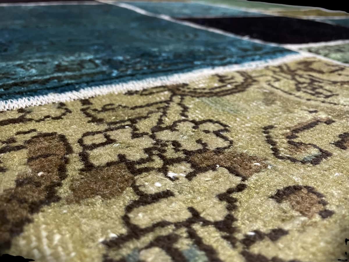 alfombra persa de estilo patchwork en dimensiones 200 centímetros de largo por 140 centímetros de ancho — Primer plano de la textura