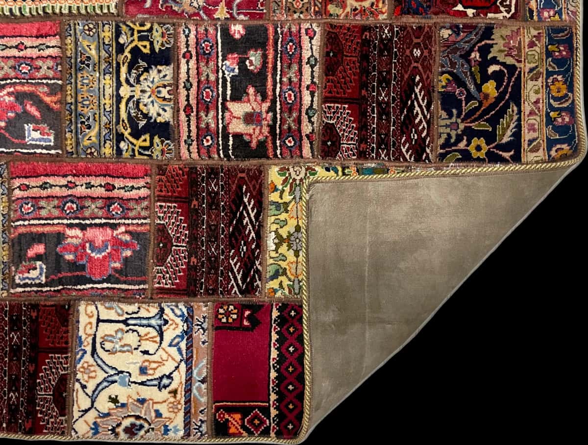 Persian rug of Patchwork style in dimensions 202 centimeters length by 150 centimeters width with mainly red and colorful colors — Folded