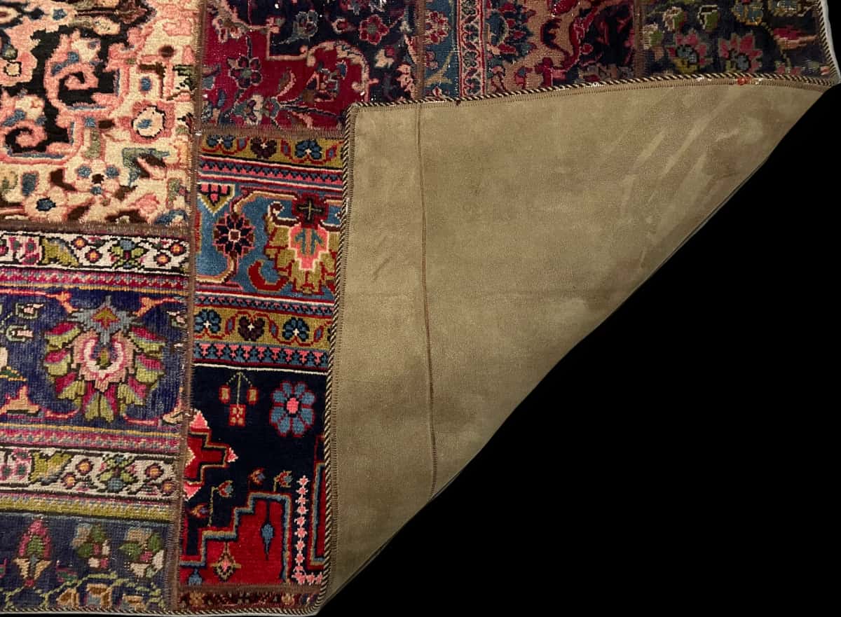 Persian rug of Patchwork style in dimensions 231 centimeters length by 151 centimeters width with mainly red and green colors — Folded
