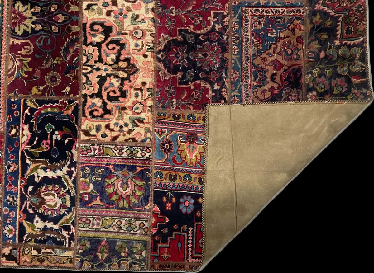 Persian rug of Patchwork style in dimensions 231 centimeters length by 151 centimeters width with mainly red and green colors — Folded