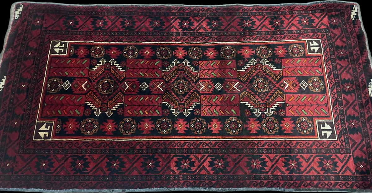 Persian rug of Baluch style in dimensions 212 centimeters length by 110 centimeters width with mainly red colors — Perspective
