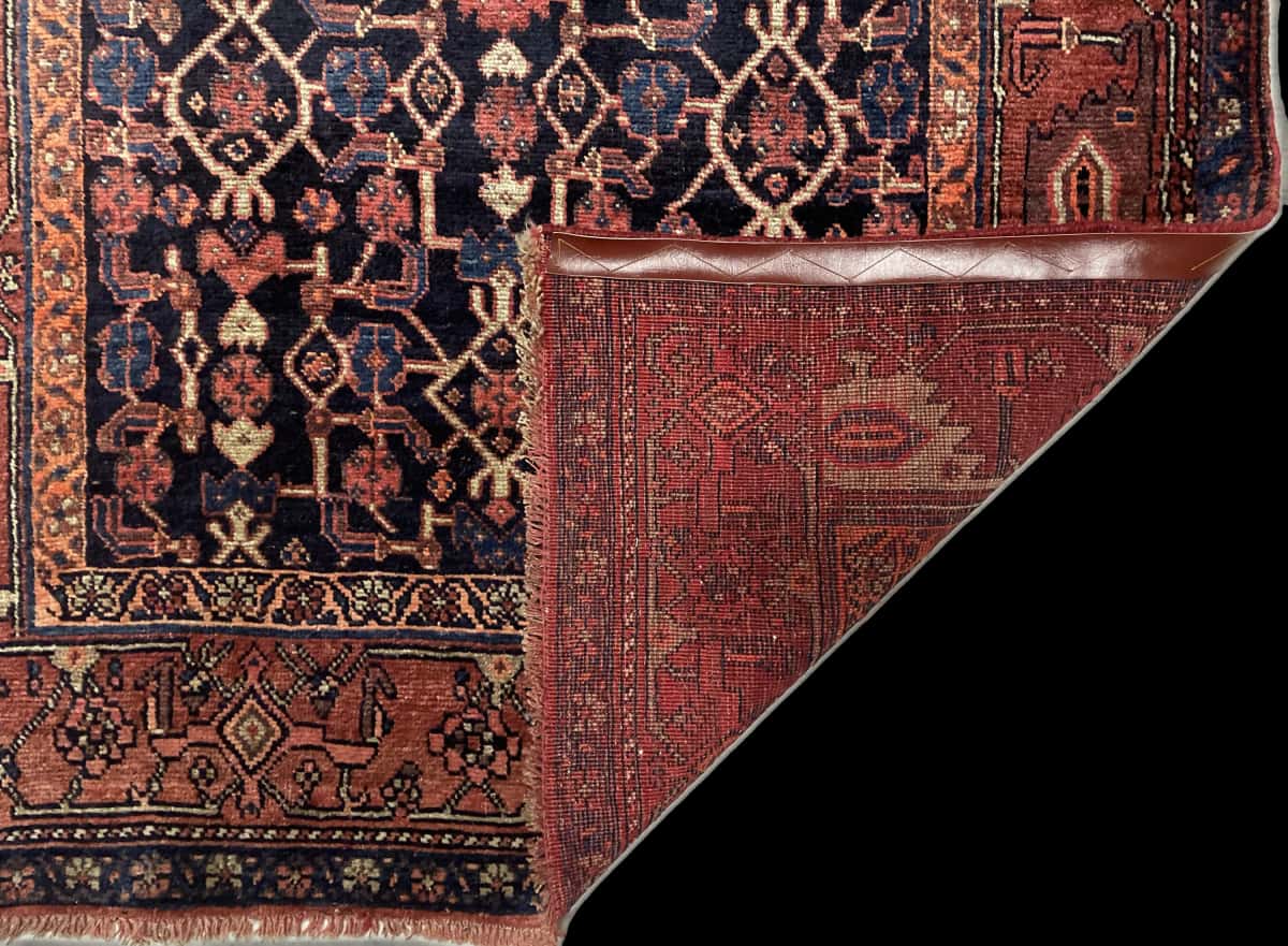 Persian rug of Borujerd style in dimensions 244 centimeters length by 130 centimeters width with mainly blue and brown colors — Folded