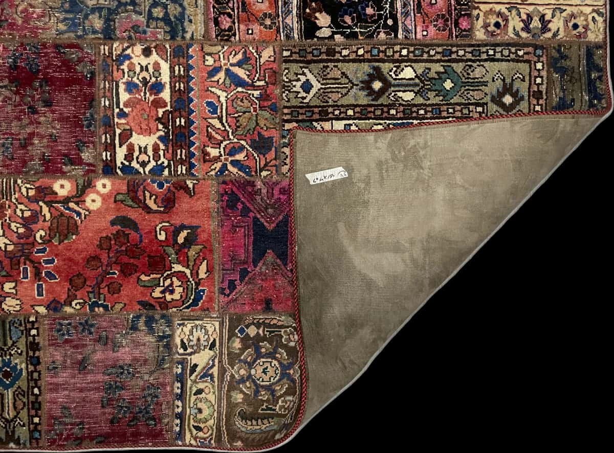 Persian rug of Patchwork style in dimensions 204 centimeters length by 151 centimeters width with mainly red colors — Folded