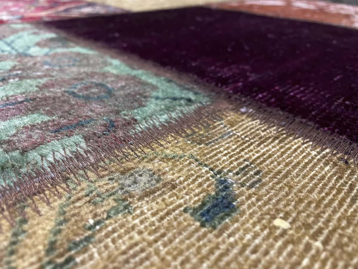 Persian rug of Patchwork style in dimensions 211 centimeters length by 150 centimeters width — Texture close-up