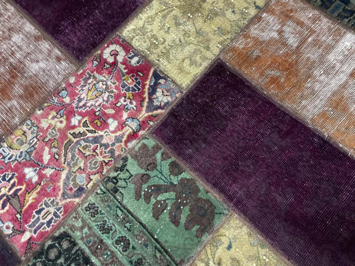 Persian rug of Patchwork style in dimensions 211 centimeters length by 150 centimeters width — Texture close-up