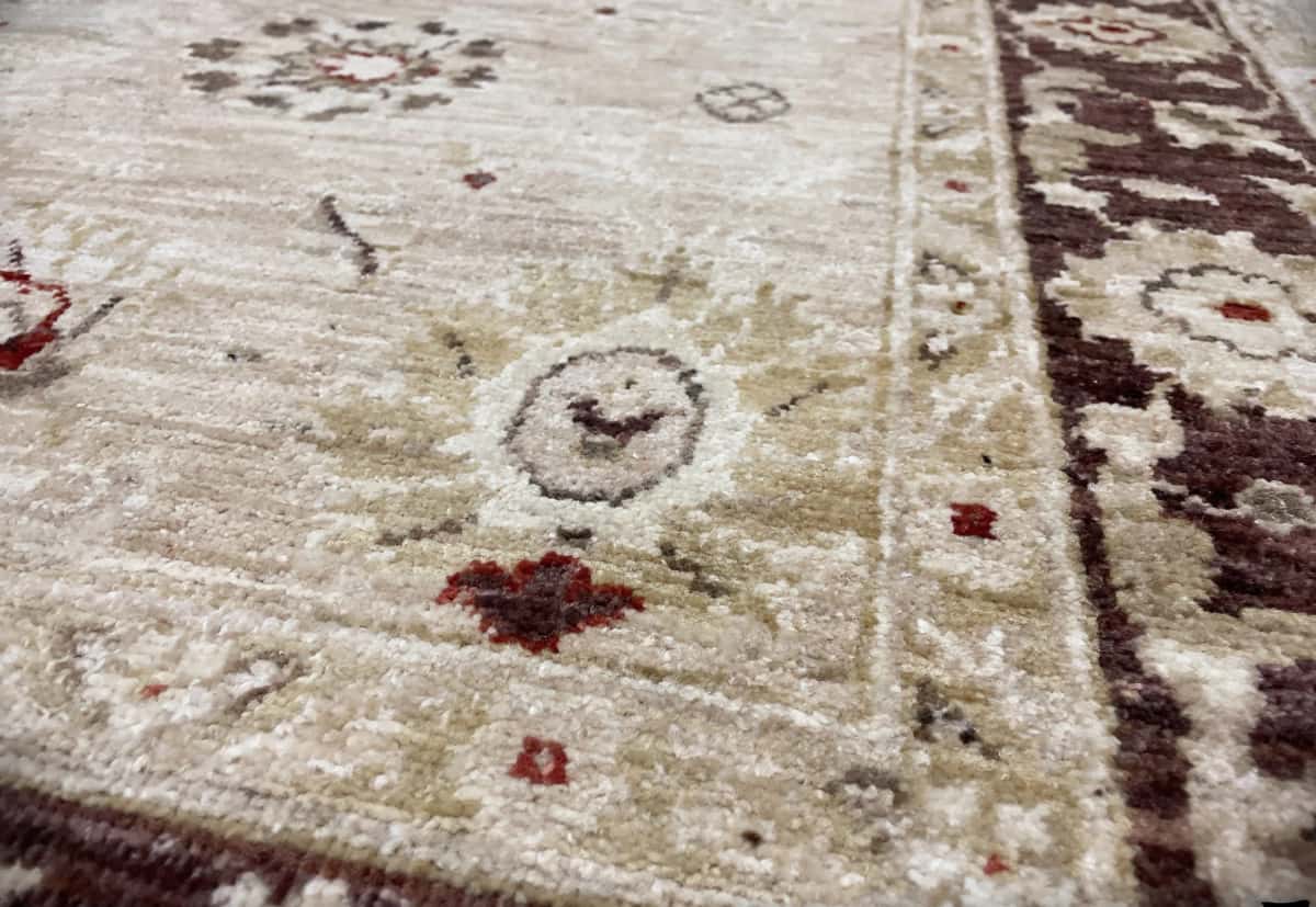Pakistan rug in dimensions 205 centimeters length by 144 centimeters width with mainly yellow and brown colors — Texture close-up