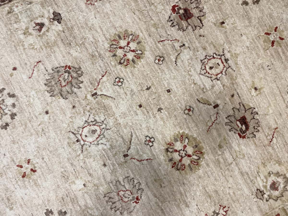 Pakistan rug in dimensions 205 centimeters length by 144 centimeters width with mainly yellow and brown colors — Texture close-up