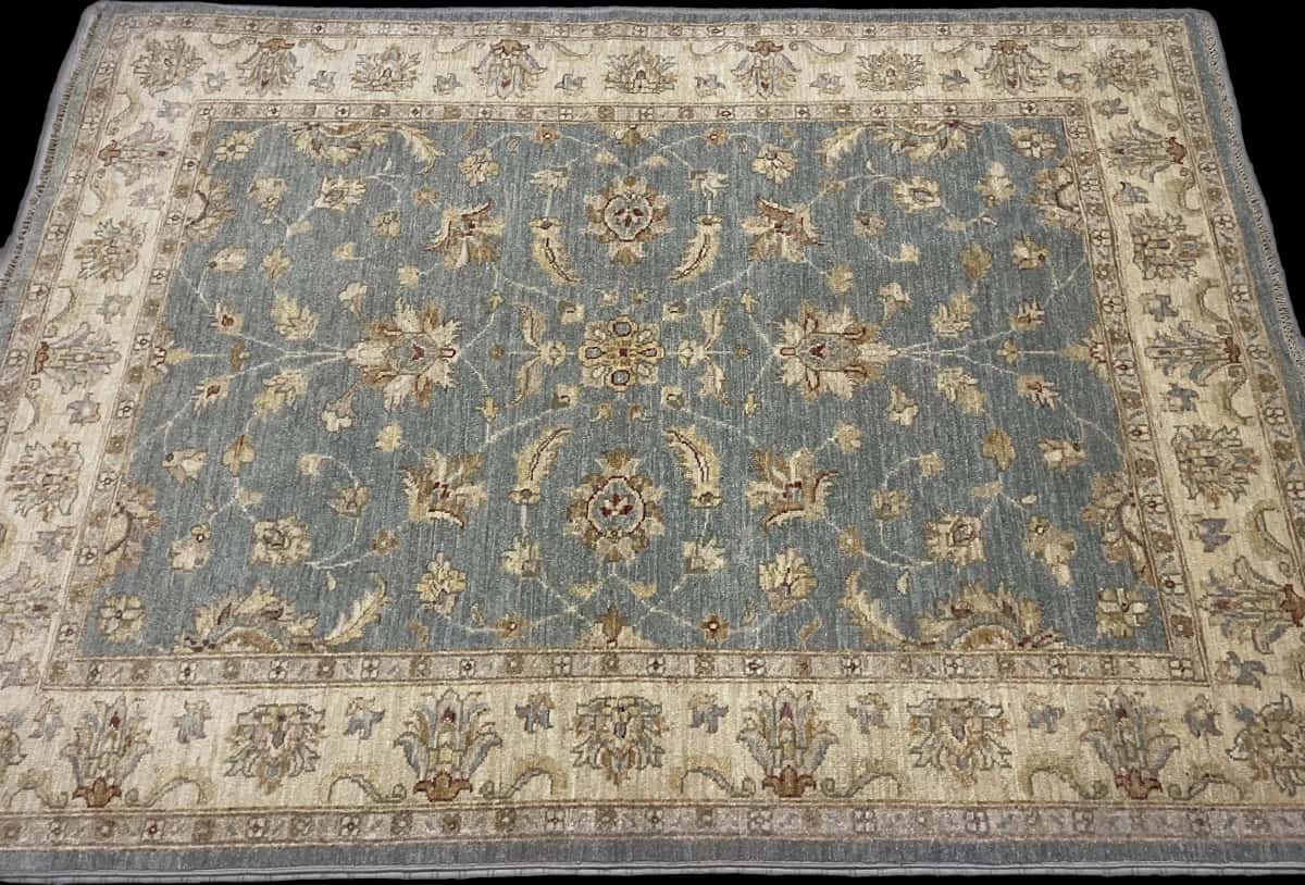 Pakistan rug in dimensions 201 centimeters length by 144 centimeters width with mainly blue and yellow colors — Perspective