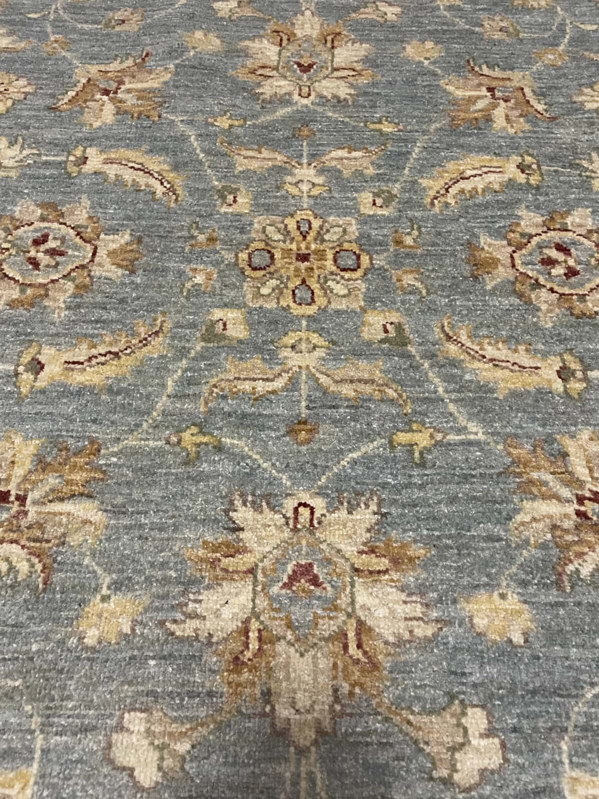 Pakistan rug in dimensions 201 centimeters length by 144 centimeters width with mainly blue and yellow colors — Texture close-up