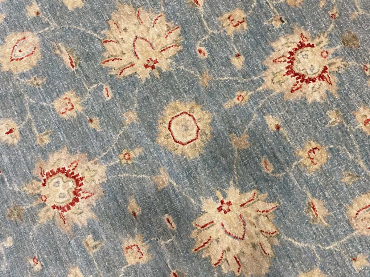Pakistan rug in dimensions 200 centimeters length by 139 centimeters width with mainly blue and yellow colors — Texture close-up