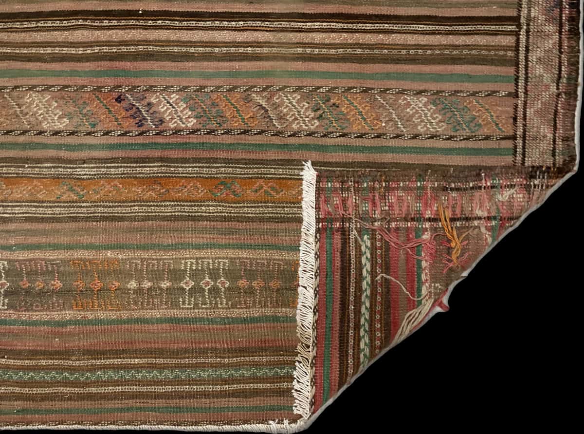 Persian rug of Sumak style in dimensions 189 centimeters length by 116 centimeters width with mainly brown colors — Folded