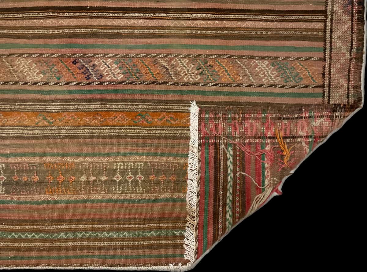 Persian rug of Sumak style in dimensions 189 centimeters length by 116 centimeters width with mainly brown colors — Folded