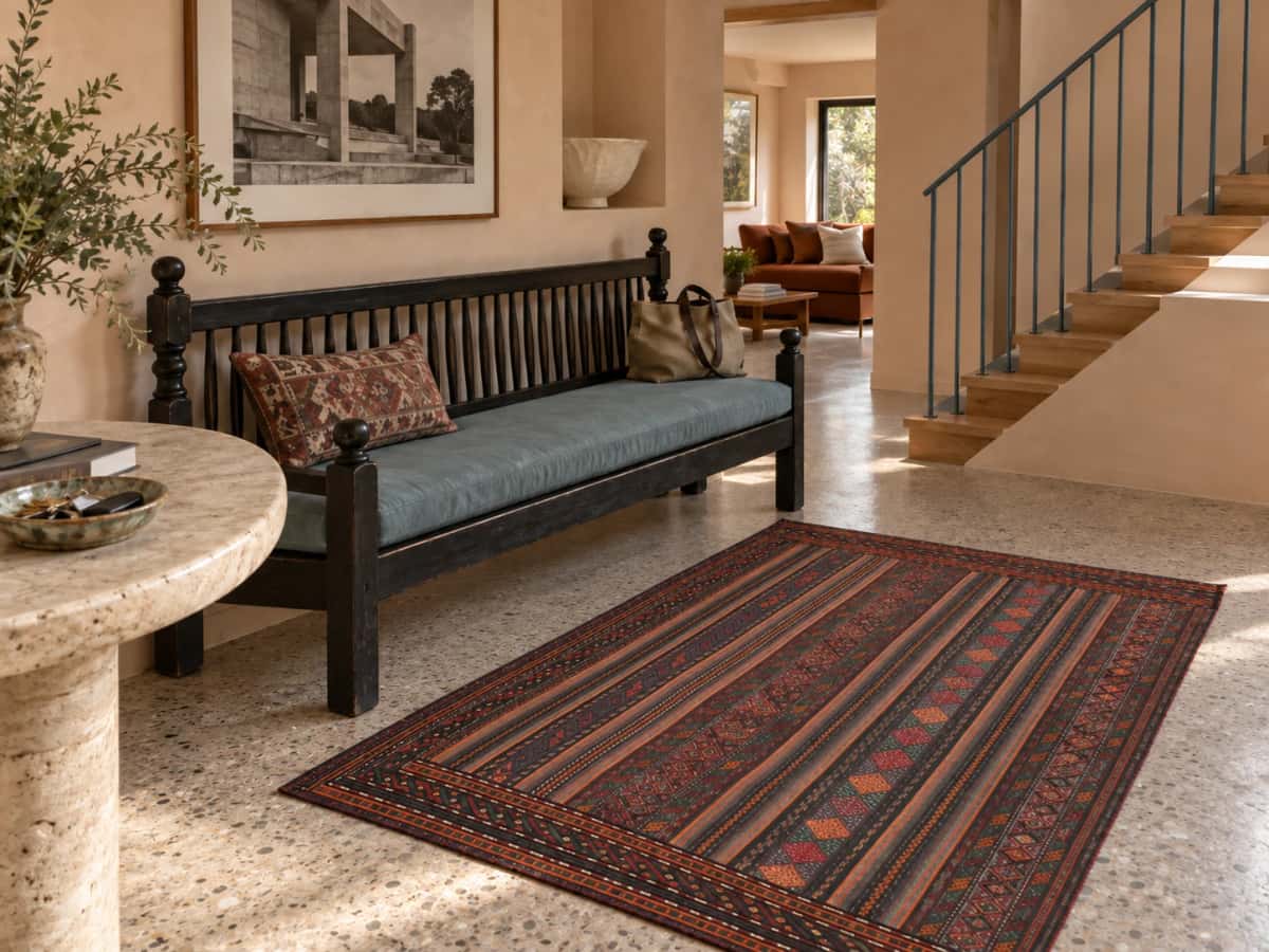 Persian Sumak Kilim rug, 113x156 cm, mainly purple and brown — In a room