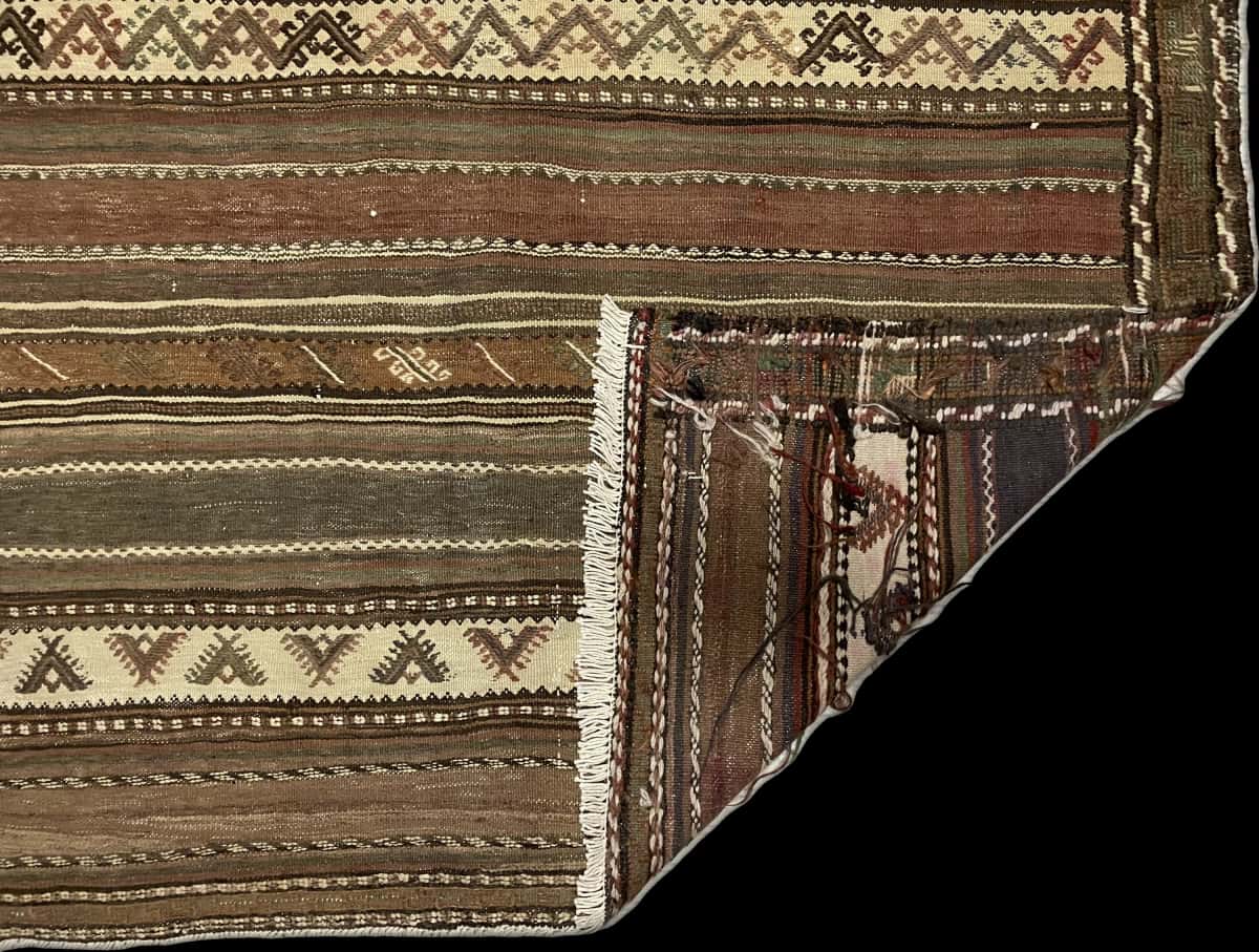 Persian rug of Sumak style in dimensions 212 centimeters length by 138 centimeters width with mainly brown colors — Folded