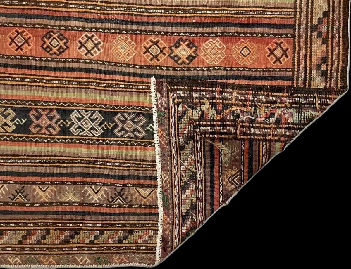 Persian rug of Sumak style in dimensions 228 centimeters length by 151 centimeters width with mainly brown colors — Folded