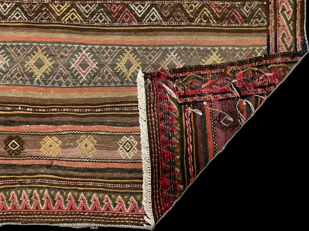 Persian rug of Sumak style in dimensions 152 centimeters length by 112 centimeters width with mainly brown colors — Folded
