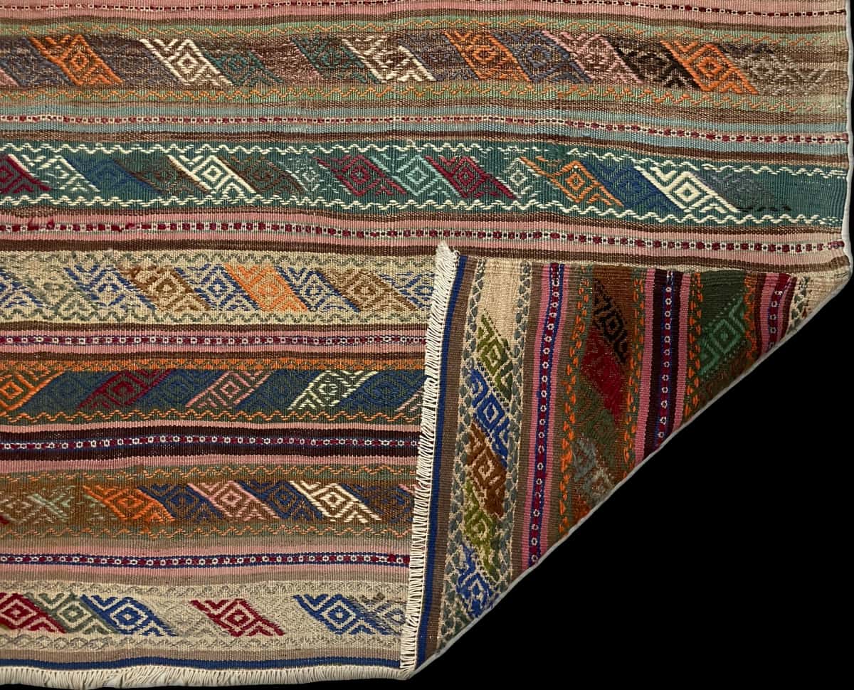 Persian rug of Sumak style in dimensions 215 centimeters length by 160 centimeters width with mainly brown and colorful colors — Folded
