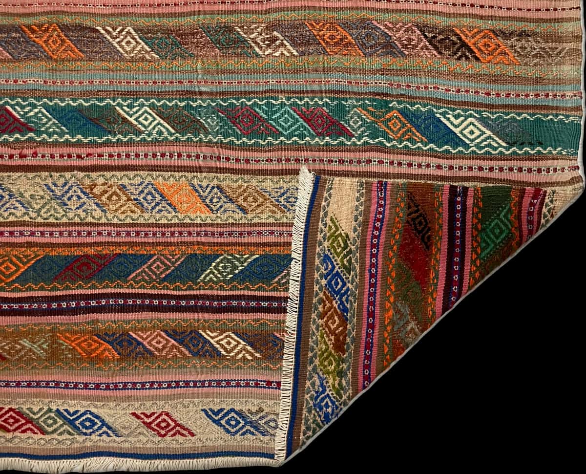 Persian rug of Sumak style in dimensions 215 centimeters length by 160 centimeters width with mainly brown and colorful colors — Folded