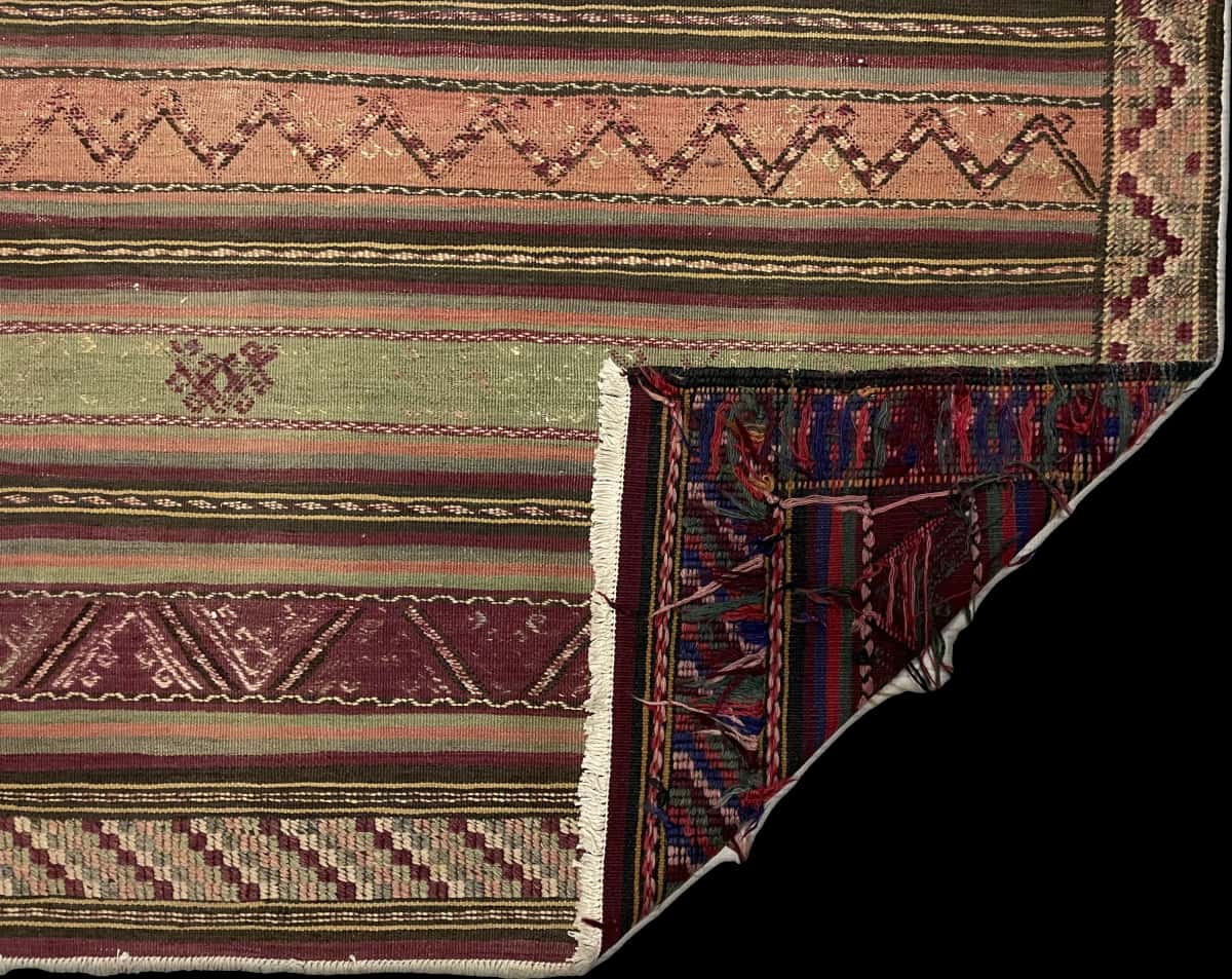 Persian rug of Sumak style in dimensions 200 centimeters length by 163 centimeters width with mainly green and purple colors — Folded