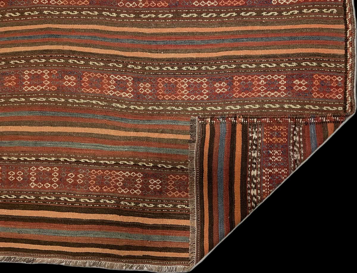 Persian rug of Sumak style in dimensions 153 centimeters length by 112 centimeters width with mainly brown colors — Folded