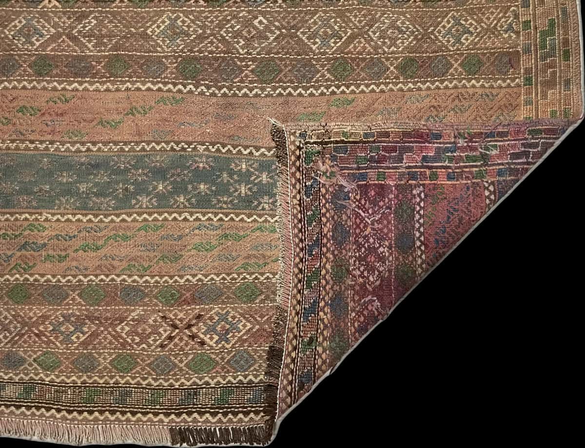 Persian rug of Sumak style in dimensions 233 centimeters length by 150 centimeters width with mainly brown colors — Folded