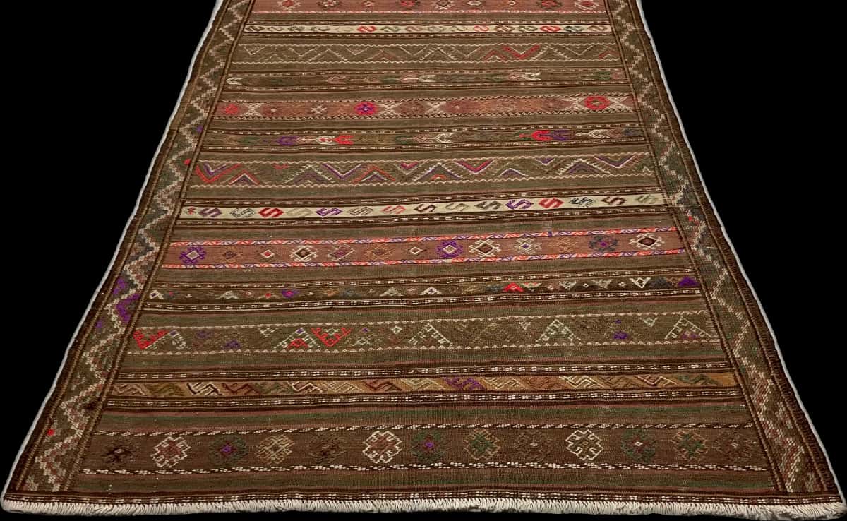 Persian rug of Sumak style in dimensions 260 centimeters length by 145 centimeters width with mainly brown and green colors — Perspective