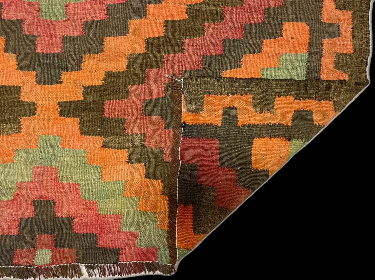 Persian rug of Khorasan style in dimensions 133 centimeters length by 130 centimeters width with mainly orange and red colors — Folded