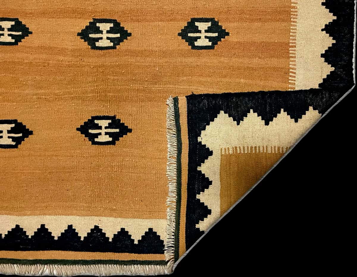 Persian rug of Kilim style in dimensions 231 centimeters length by 160 centimeters width with mainly yellow colors — Folded