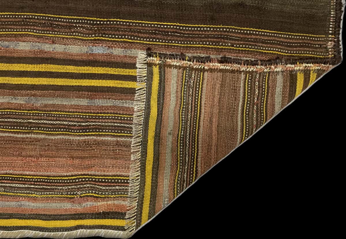 Persian rug of Sumak style in dimensions 141 centimeters length by 117 centimeters width with mainly yellow and brown colors — Folded