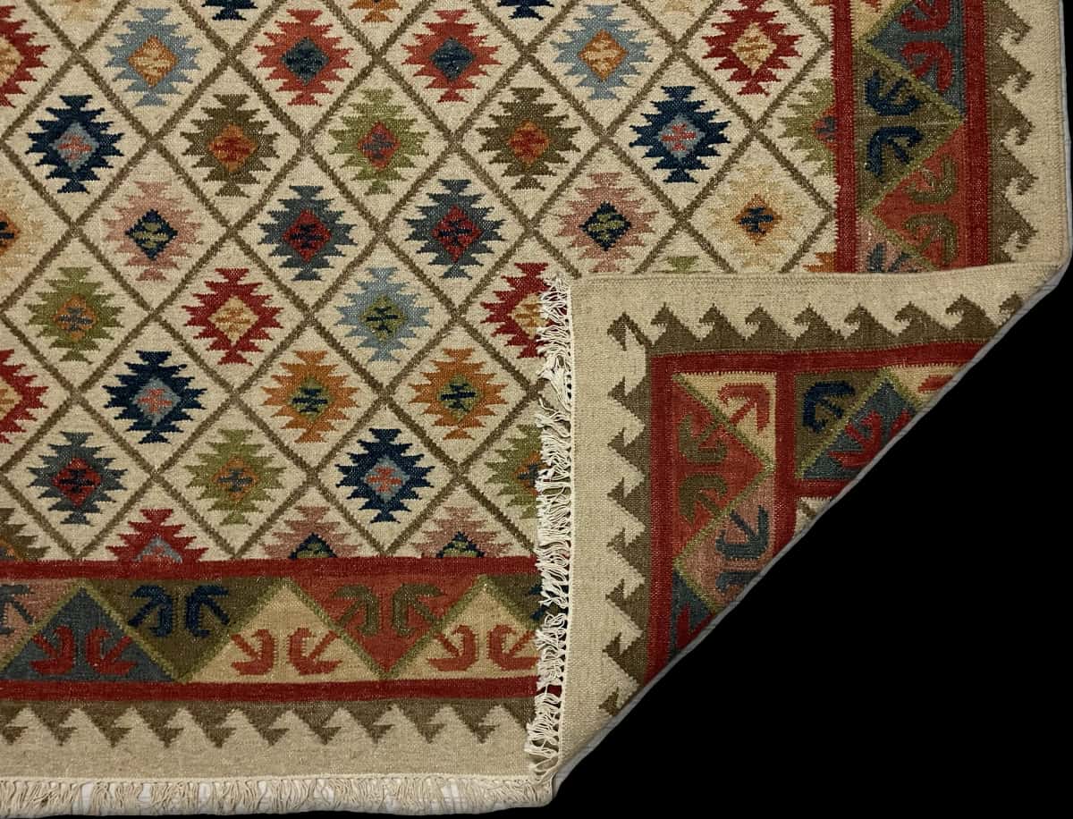 Indian rug of Kilim style in dimensions 274 centimeters length by 183 centimeters width with mainly beige and colorful colors — Folded