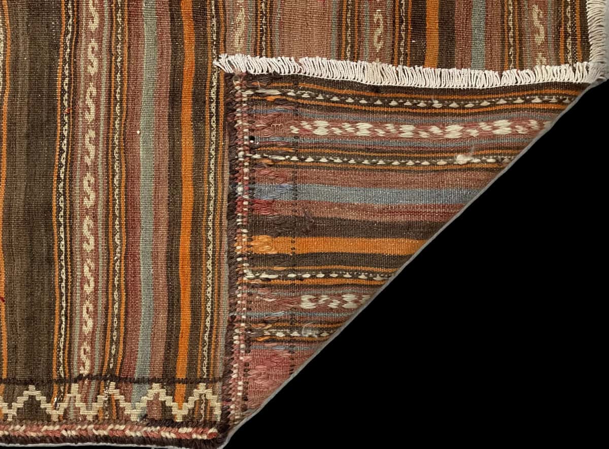 Persian rug of Sumak style in dimensions 163 centimeters length by 138 centimeters width with mainly brown colors — Folded