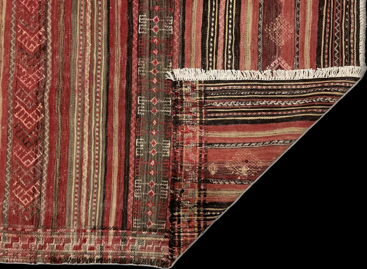 Persian rug of Sumak style in dimensions 165 centimeters length by 154 centimeters width with mainly red colors — Folded