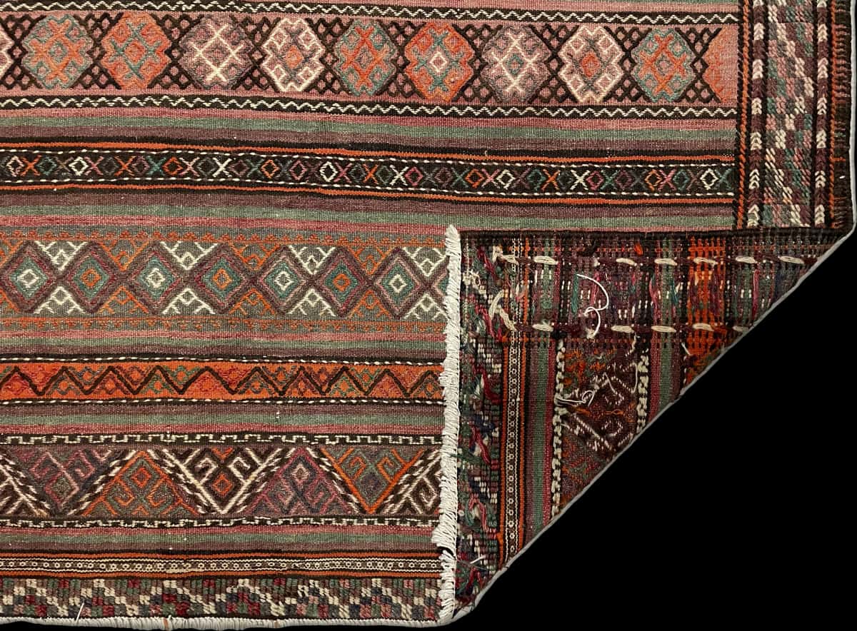 Persian rug of Sumak style in dimensions 247 centimeters length by 160 centimeters width with mainly red and brown colors — Folded