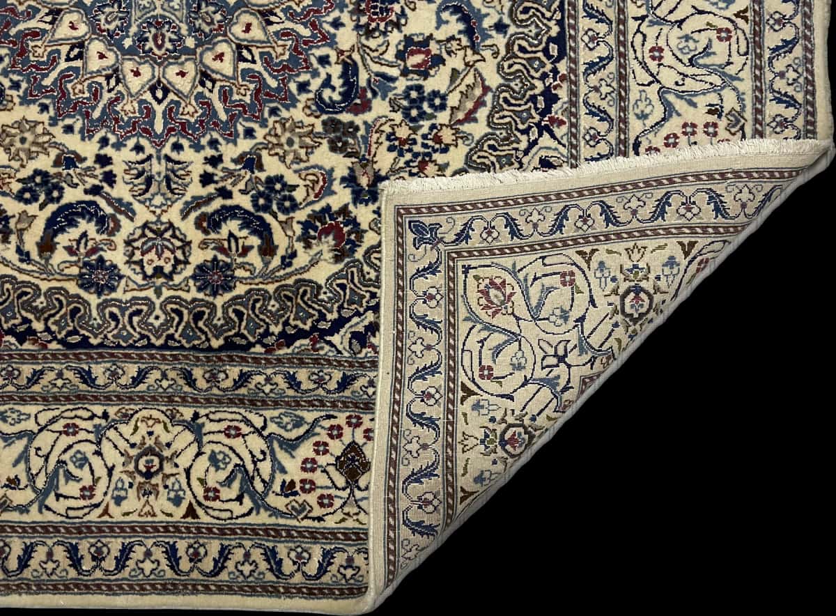 Persian rug of Nain style in dimensions 200 centimeters length by 192 centimeters width with mainly beige and red colors — Folded