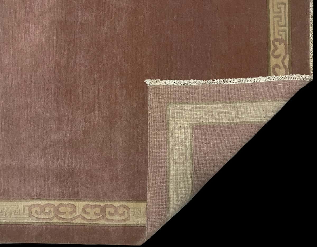Nepali rug of Tibetan style in dimensions 255 centimeters length by 202 centimeters width with mainly pink colors — Folded