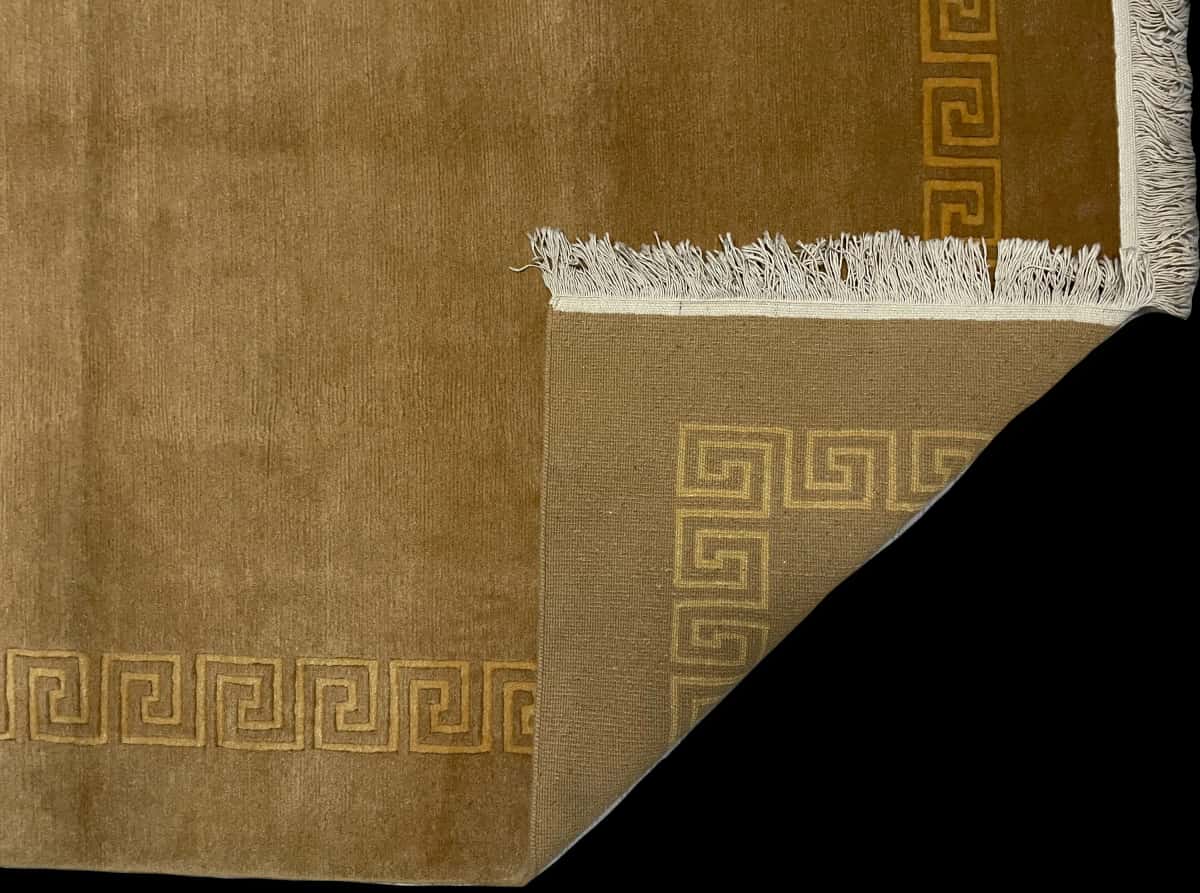Nepali rug of Tibetan style in dimensions 240 centimeters length by 173 centimeters width with mainly yellow colors — Folded