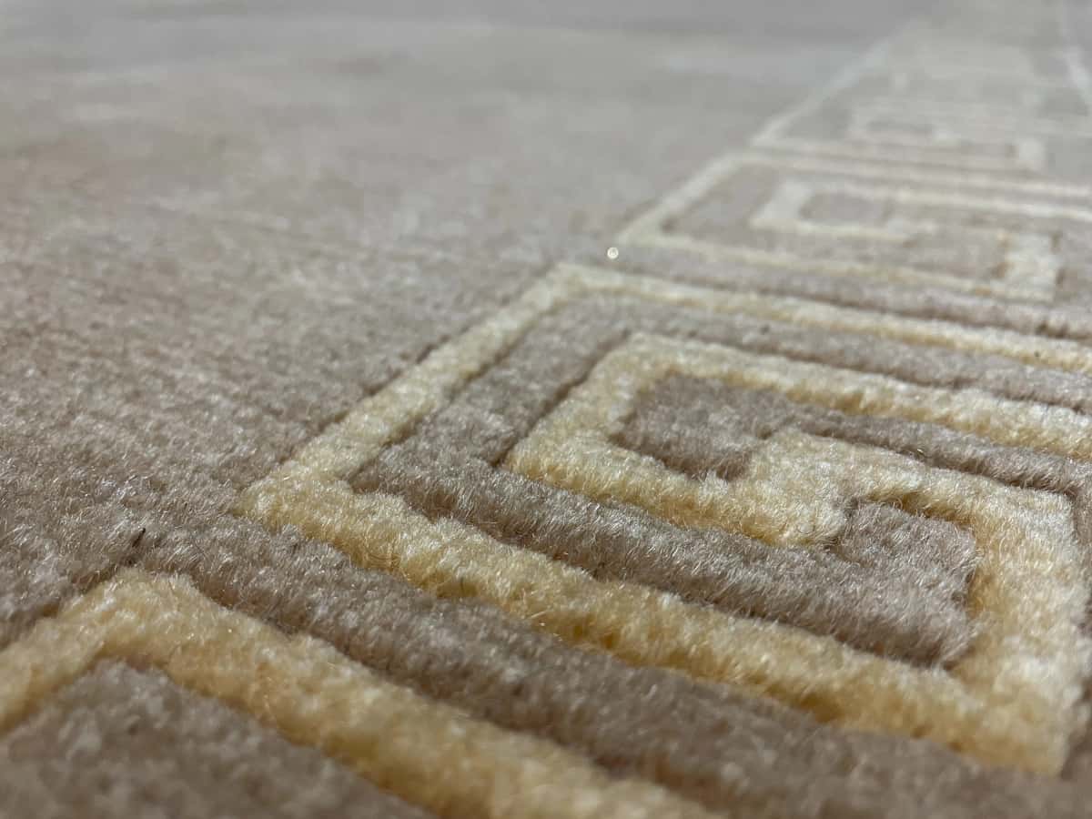Nepali rug of Tibetan style in dimensions 240 centimeters length by 173 centimeters width with mainly yellow colors — Texture close-up