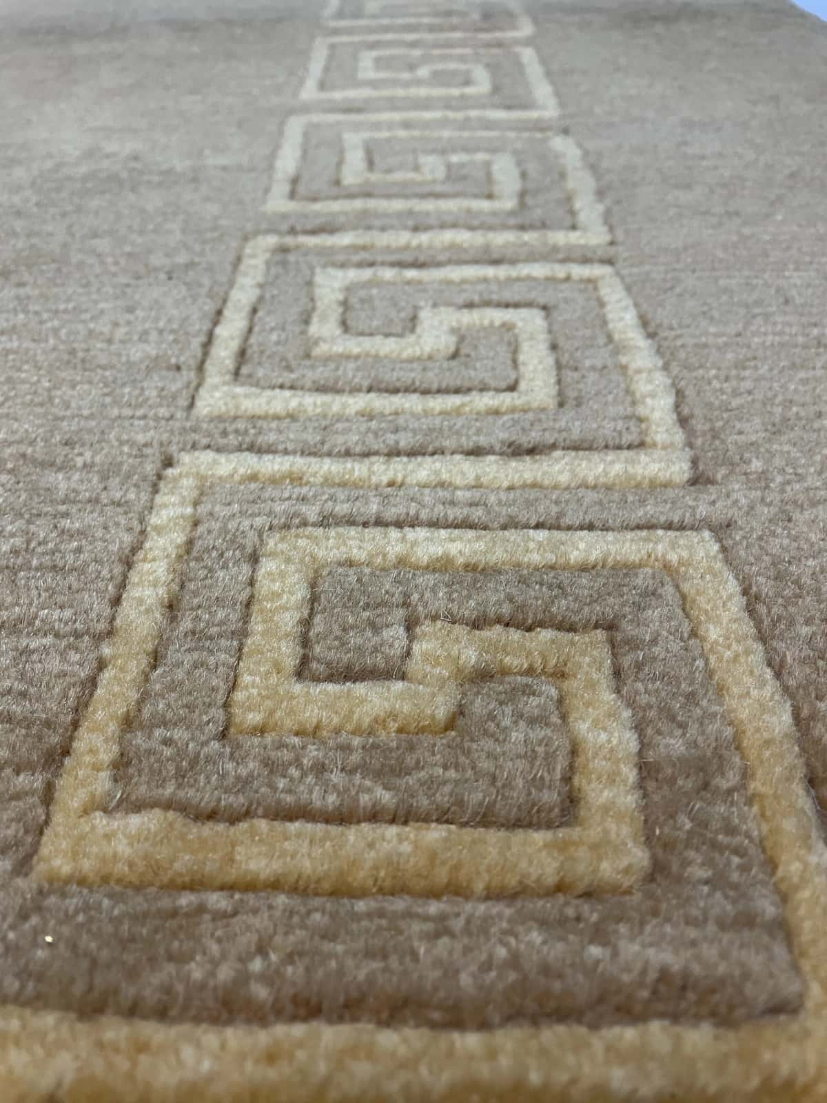 Nepali rug of Tibetan style in dimensions 240 centimeters length by 173 centimeters width with mainly yellow colors — Texture close-up