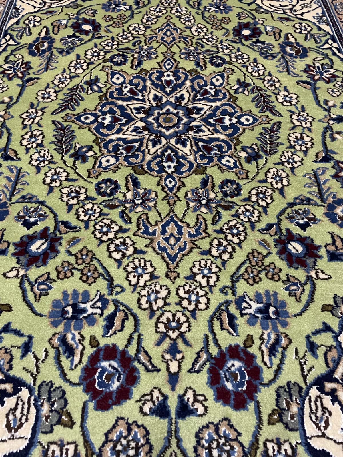 Persian rug of Nain style in dimensions 208 centimeters length by 146 centimeters width with mainly green and blue colors — Perspective