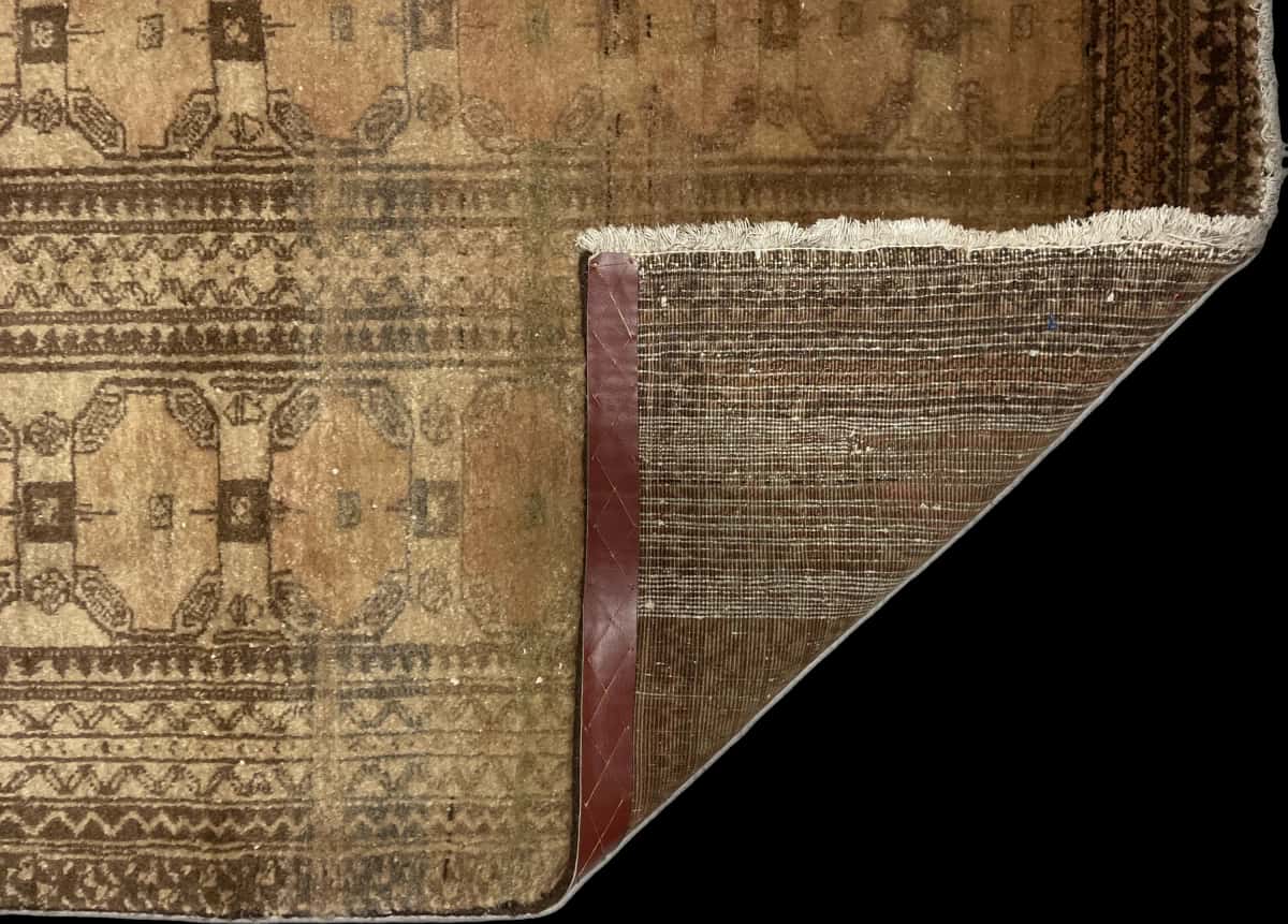 Persian rug of Baluch style in dimensions 182 centimeters length by 94 centimeters width with mainly brown colors — Folded