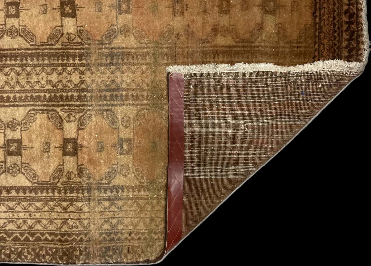 Persian rug of Baluch style in dimensions 182 centimeters length by 94 centimeters width with mainly brown colors — Folded